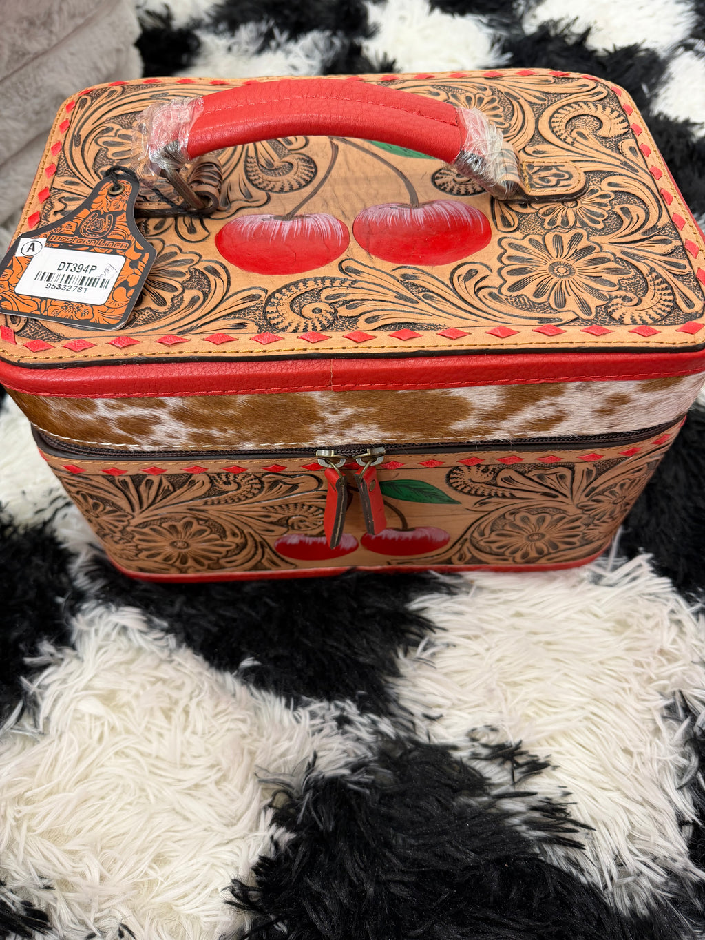 Large cherry tooled leather and cowhide jewelry box
