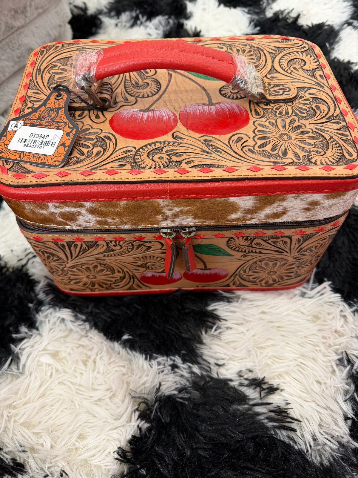 Large cherry tooled leather and cowhide jewelry box
